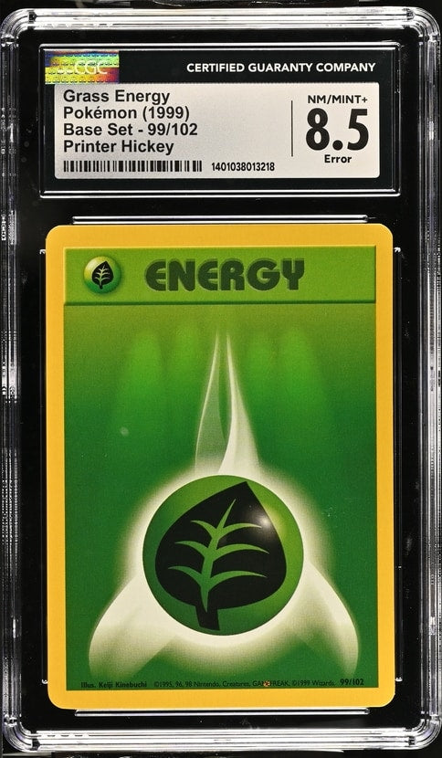 Carta Pokémon Print Error Print Hickey Grass Energy · Emerald #101/106 (CGC 8.5) — pieza única en Moon's Collectibles México